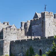 View of Cahir Castle with trees in front