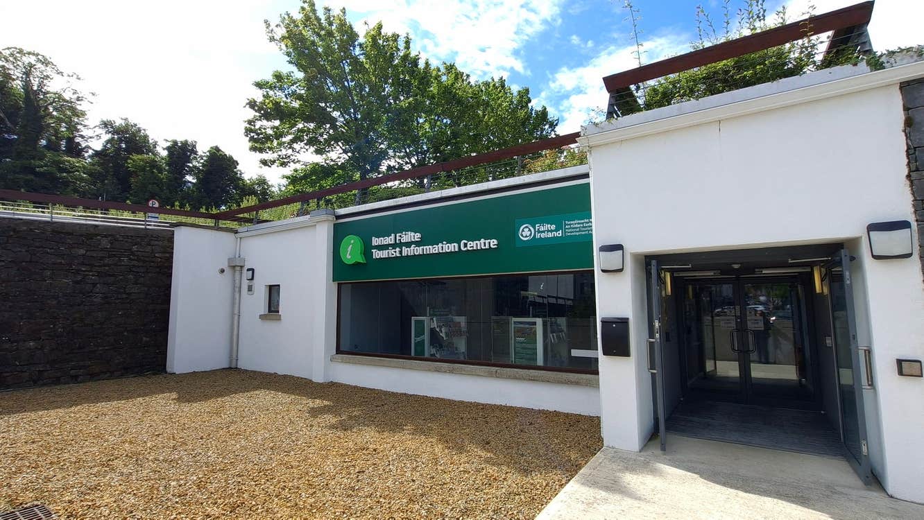 Exterior of a tourist office with official branding above the window