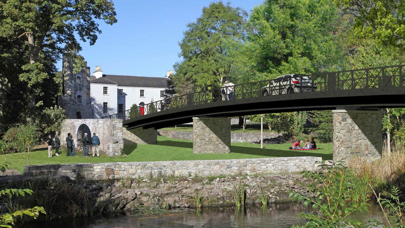 Castlecoote House exterior view with the river and bridge in the foreground