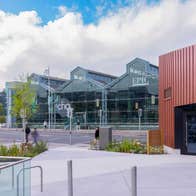 Specialised Daily Guided tour - CHQ Tour, front of large warehouse style building with glass fronts.