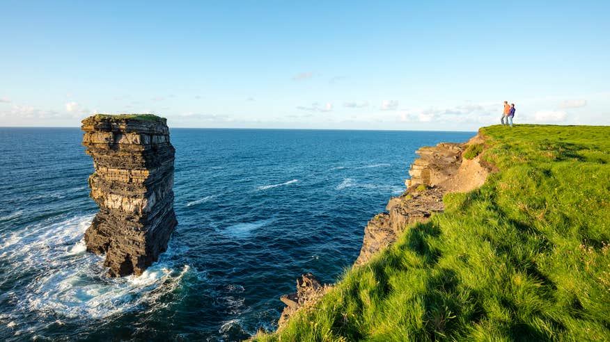 People looking out at Downpatrick Head in Mayo