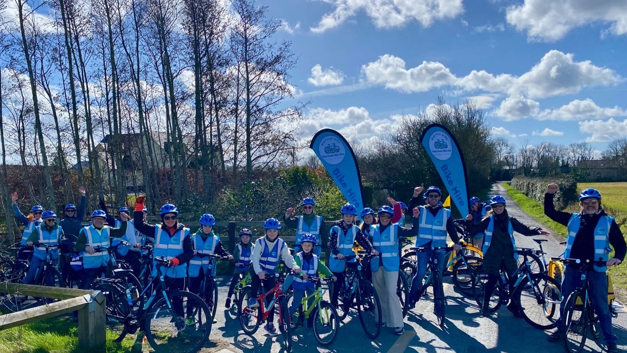A large group of people out cycling with East Coast Bike Hire