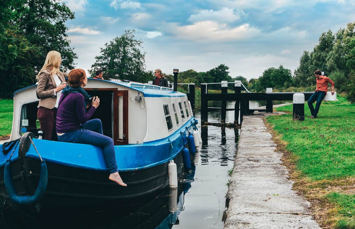People on a boat on a canal with Sallins Grand Canal Barge Trip, Kildare