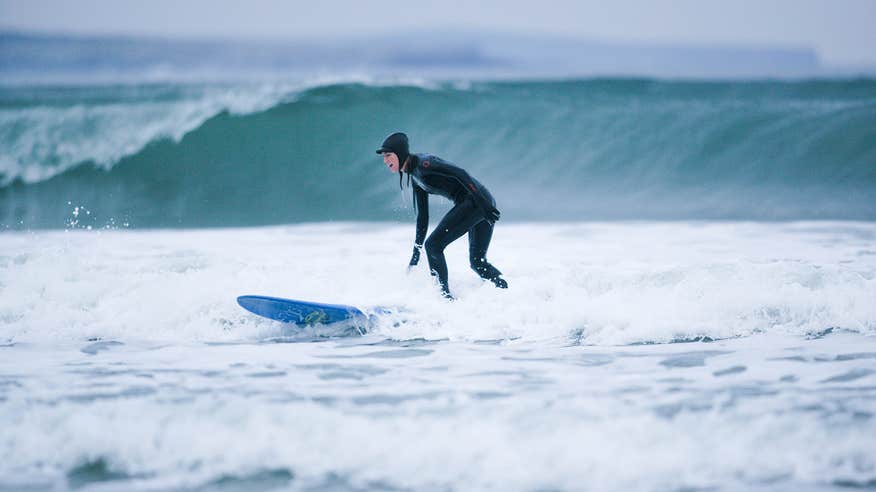 A surfer at Strandhill in County Sligo wearing a wetuit
