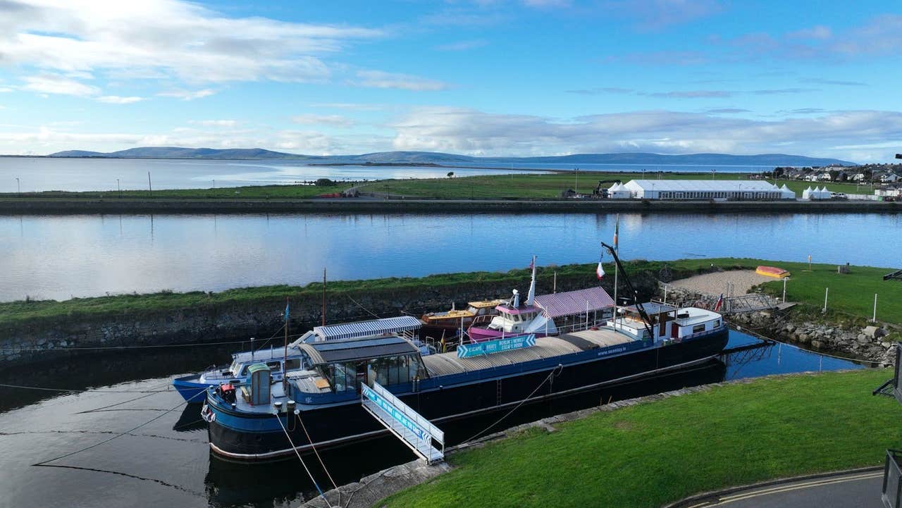 Exterior of a large boat with business signs