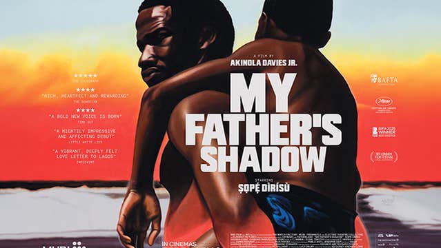 On a film poster, a man is carrying his son on his back.