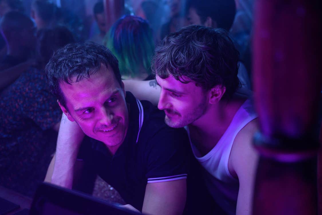 Paul Mescal has his arm around the shoulder of Andrew Scott in a nightclub.