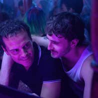 Paul Mescal has his arm around the shoulder of Andrew Scott in a nightclub.