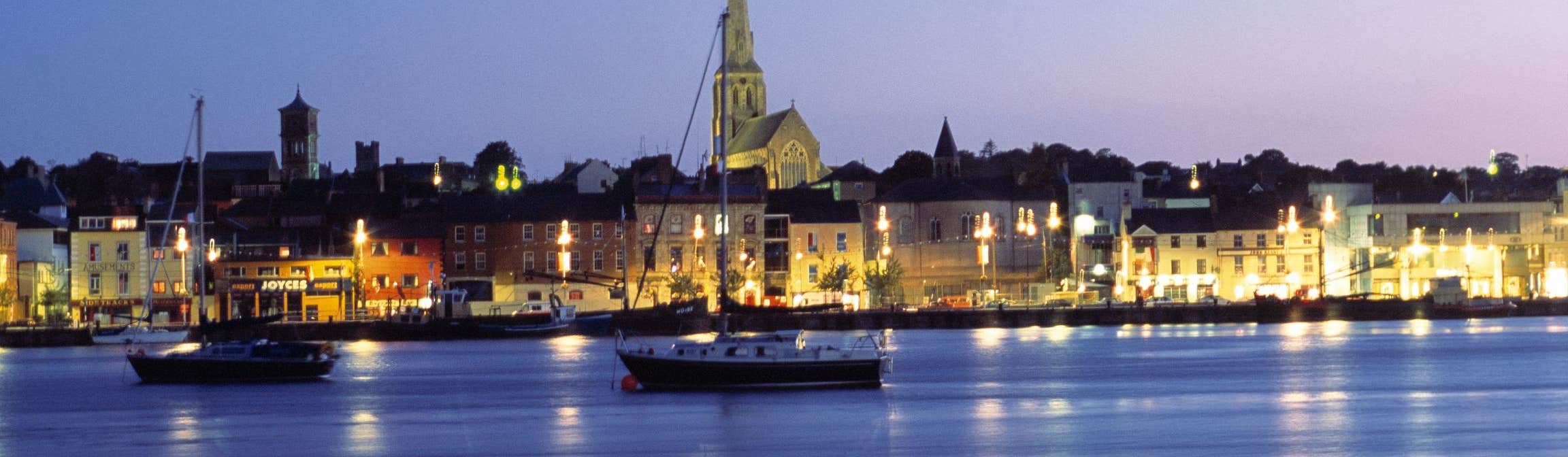Boats in front of Wexford Town at night in Wexford