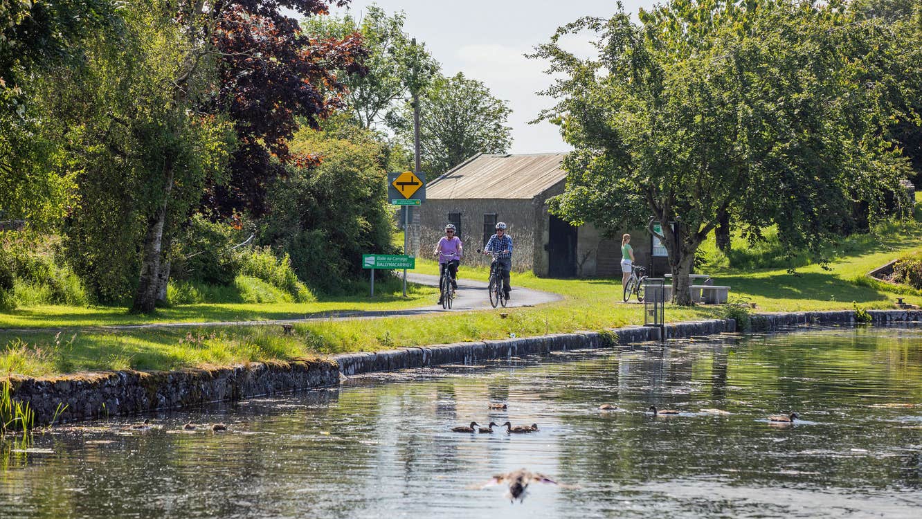 Two cyclists cycling along the Royal Canal Greenway