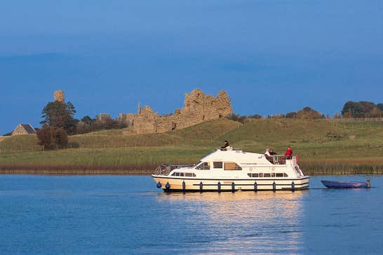A group of people on a boat cruising the River Shannon near Clonmacnoise, Co.Offaly