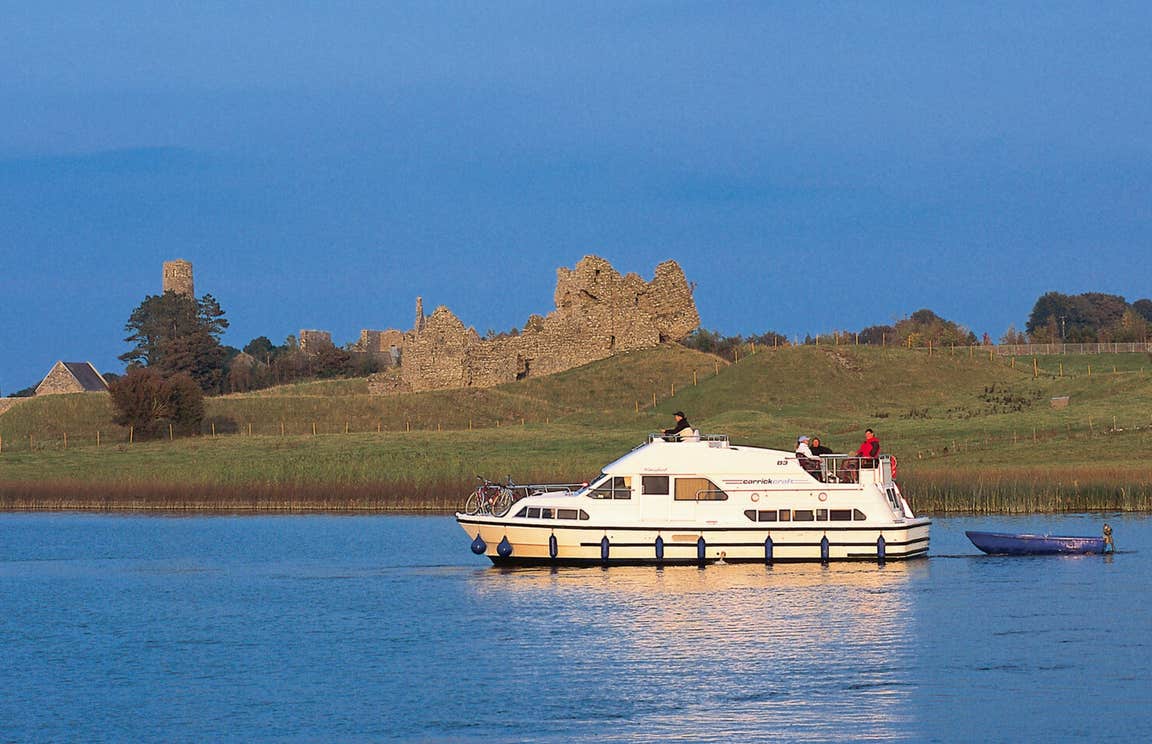 A group of people on a boat cruising the River Shannon near Clonmacnoise, Co.Offaly