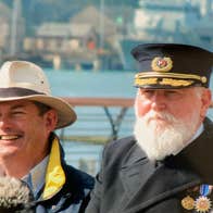 Titanic Trail tour guide with an actor posing as Captain Smith