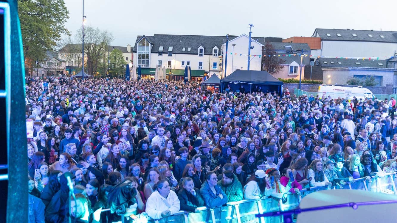 People enjoying a music concert at Queen Maeve Square