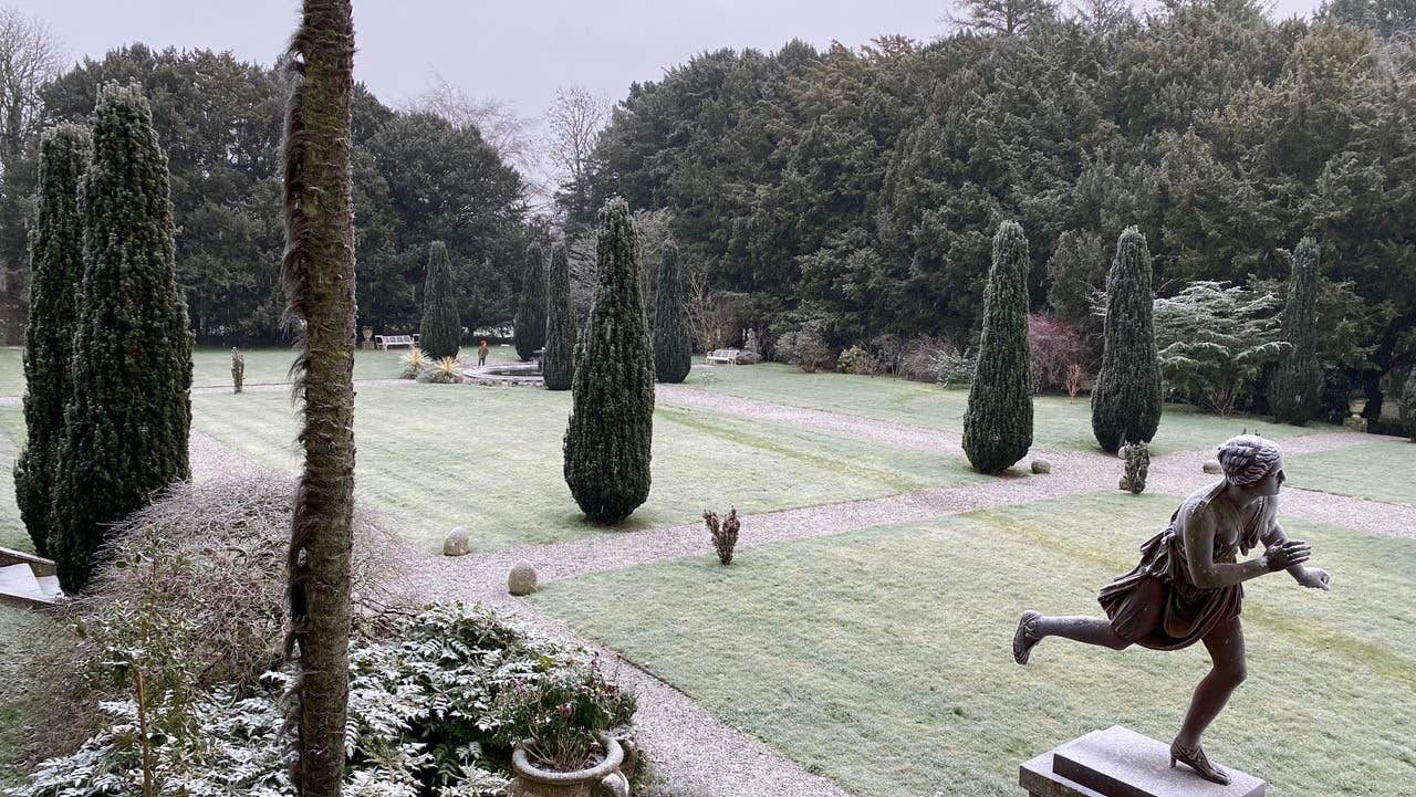 View of formal gardens with covering of frost.