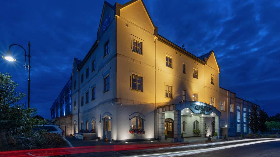 Exterior of the hotel by night.