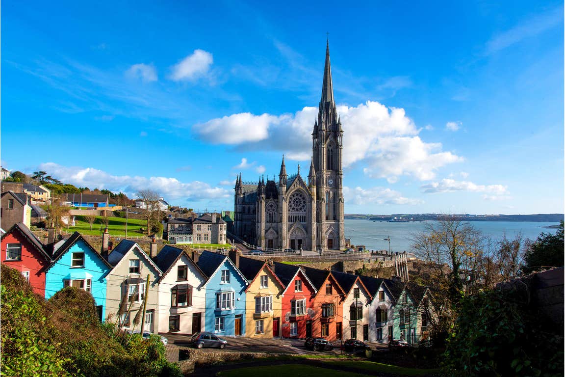 Colourful buildings in front of a cathedral in Cobh, Cork