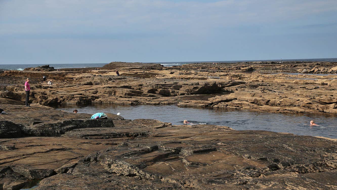People swimming at the Pollock Holes, Kilkee, Co. Clare