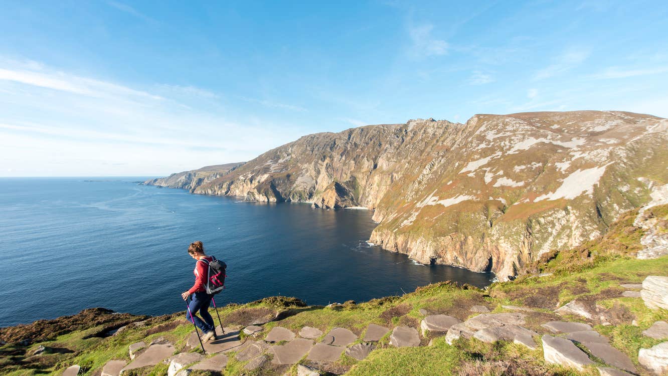 A woman hiking Sliabh Liag (Slieve League) in County Donegal