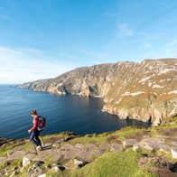 A woman hiking Sliabh Liag (Slieve League) in County Donegal