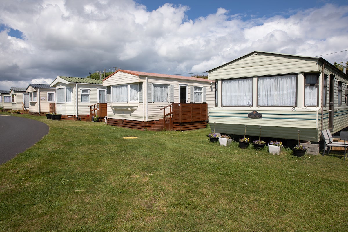 Image of a row of mobile homes.