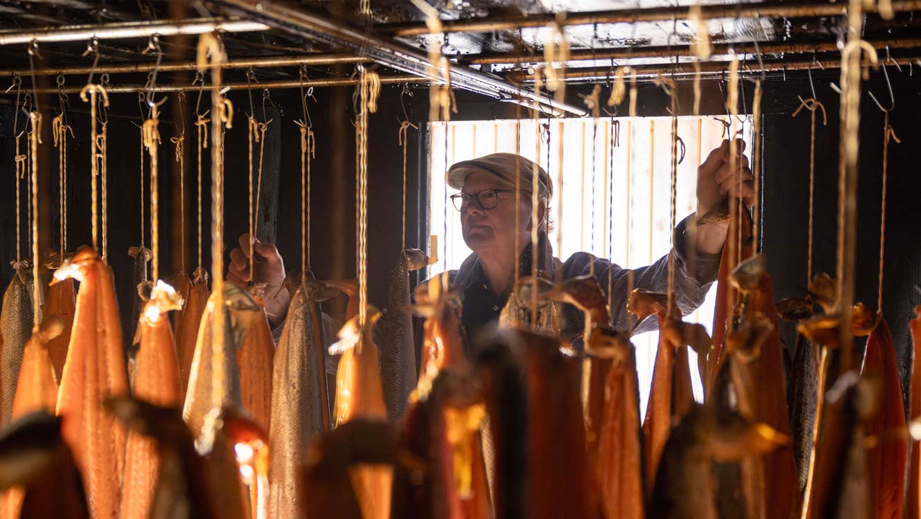 Frank Hederman working with fillets of fish hanging while been smoked
