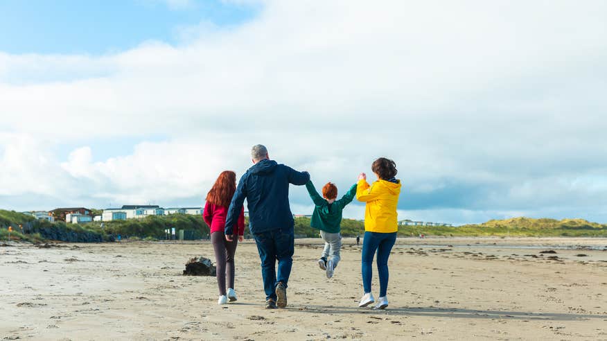 A family on Enniscrone Beach in Co Sligo.