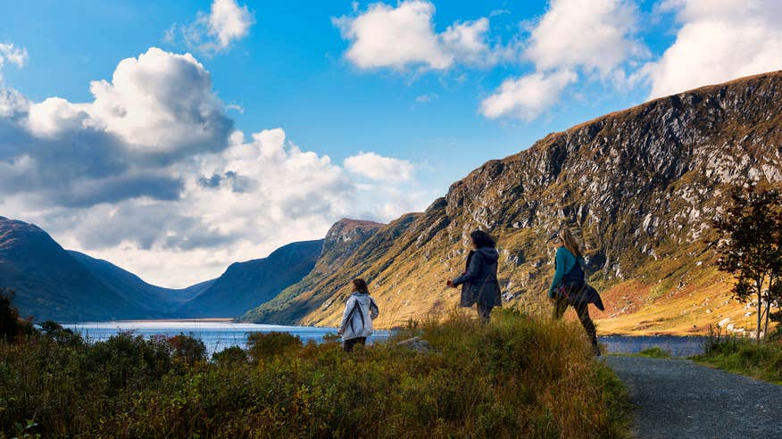 Three people hiking in the Glenveagh National Park in County Donegal.