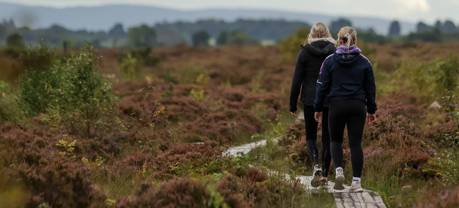 Two women walking the Laghile and Loughan Loop walk in Scohaboy Bog, County Tipperary