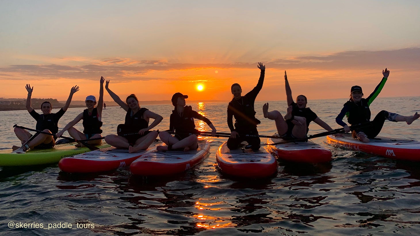 Group of Skerries Paddle Tours paddleboarders at sunset, Skerries, Dublin.