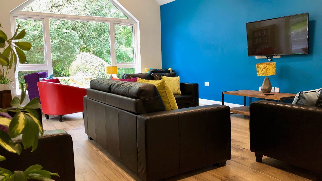 View of sitting room with couchs and chairs