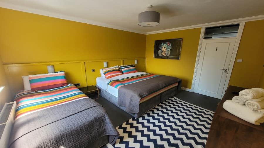 Bedroom with vibrant yellow walls