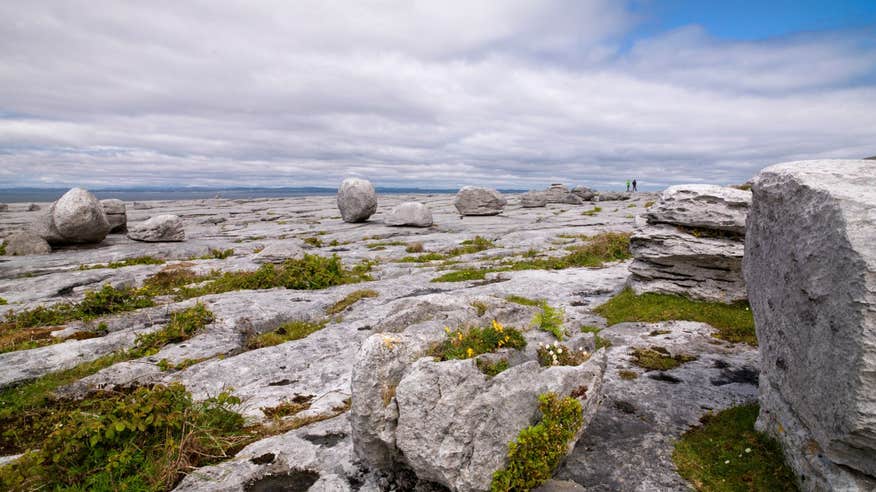 People walking through the karst landscape on Black Head Looped Walk, The Burren, Clare