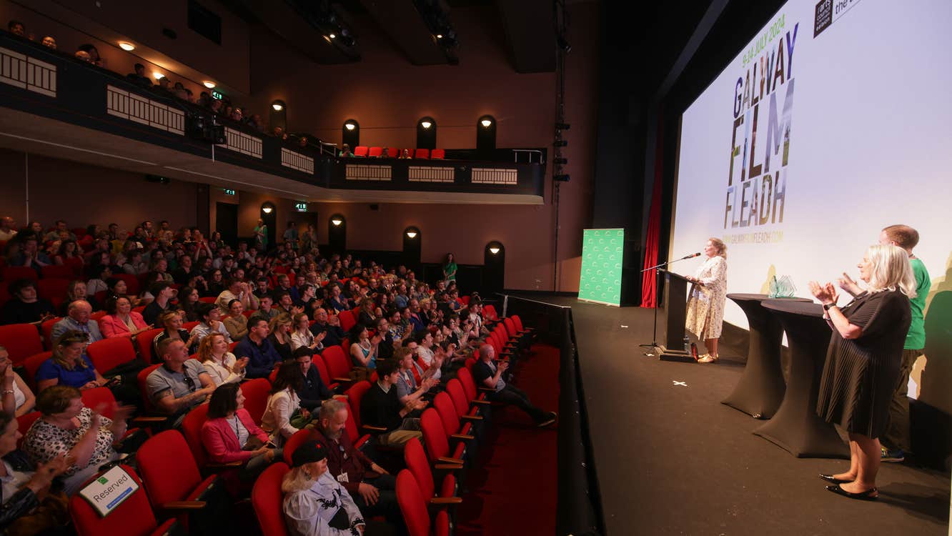 Awards Ceremony at Town Hall Theatre with board members Annie Doona and Kate O'Toole on stage.