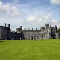 Blue skies and green grass at majestic Kilkenny Castle