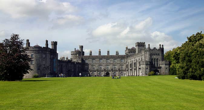 Blue skies and green grass at majestic Kilkenny Castle