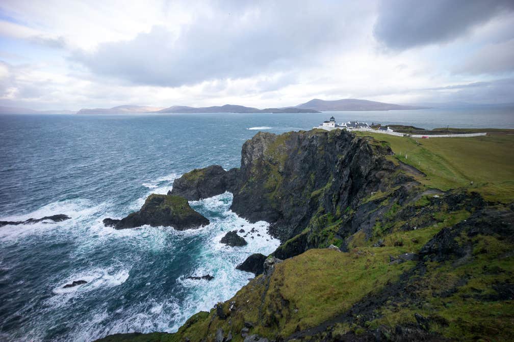 A lighthouse on the edge of a cliff on Clare Island in County Mayo