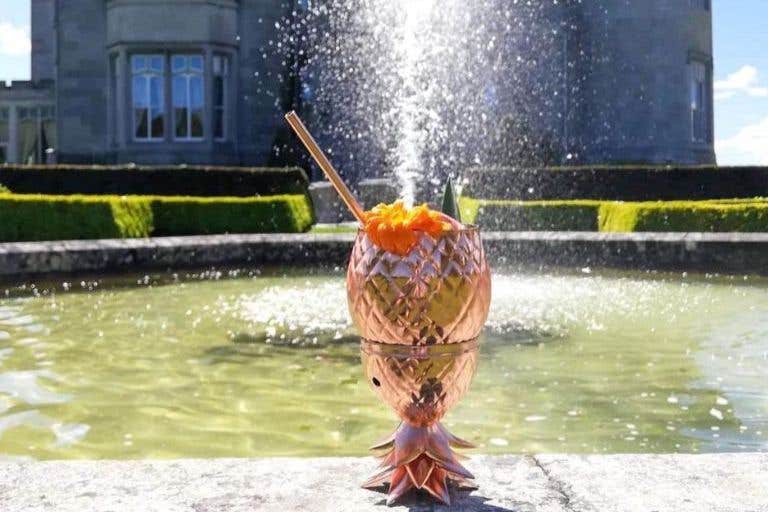 A cocktail beside a fountain at Dromoland Castle Hotel, Clare