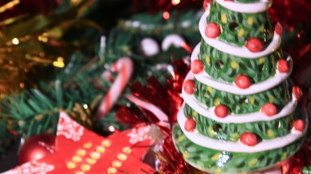 A star shaped hanging tree ornament and a 3D Christmas tree tealight holder.