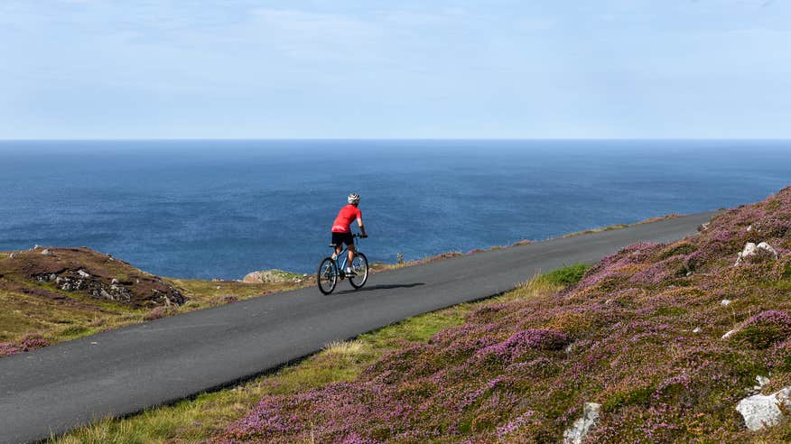 A man cycling on Arranmore Island in County Donegal