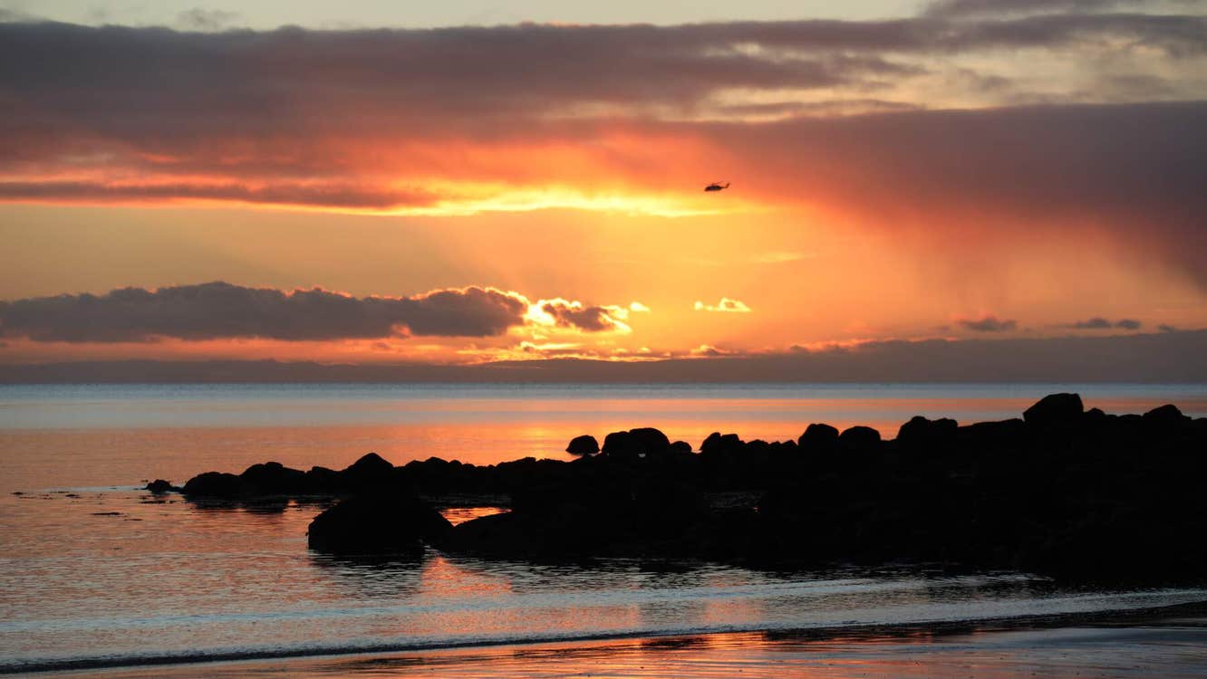 Sunset over the sea and rocks
