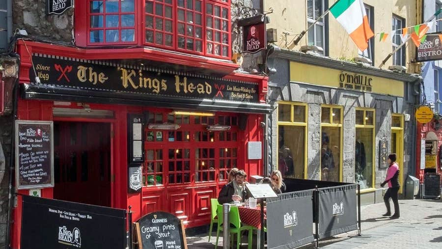 View of the exterior of the Kings Head pub with menus outside