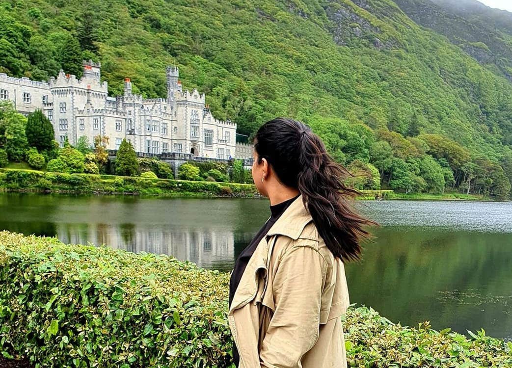 A lady looking out at Kylemore Abbey