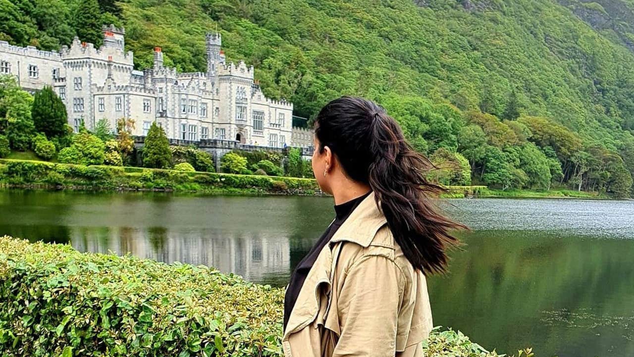A lady looking out at Kylemore Abbey