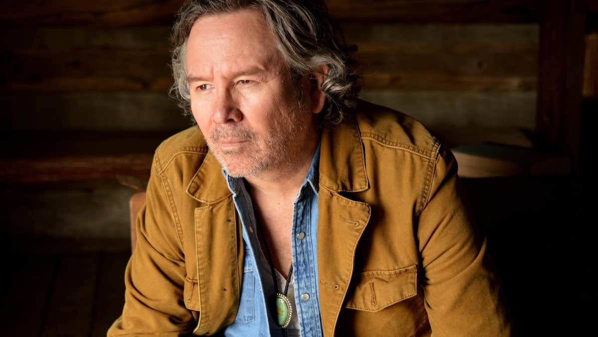 A man looking thoughtful, looking away to this right