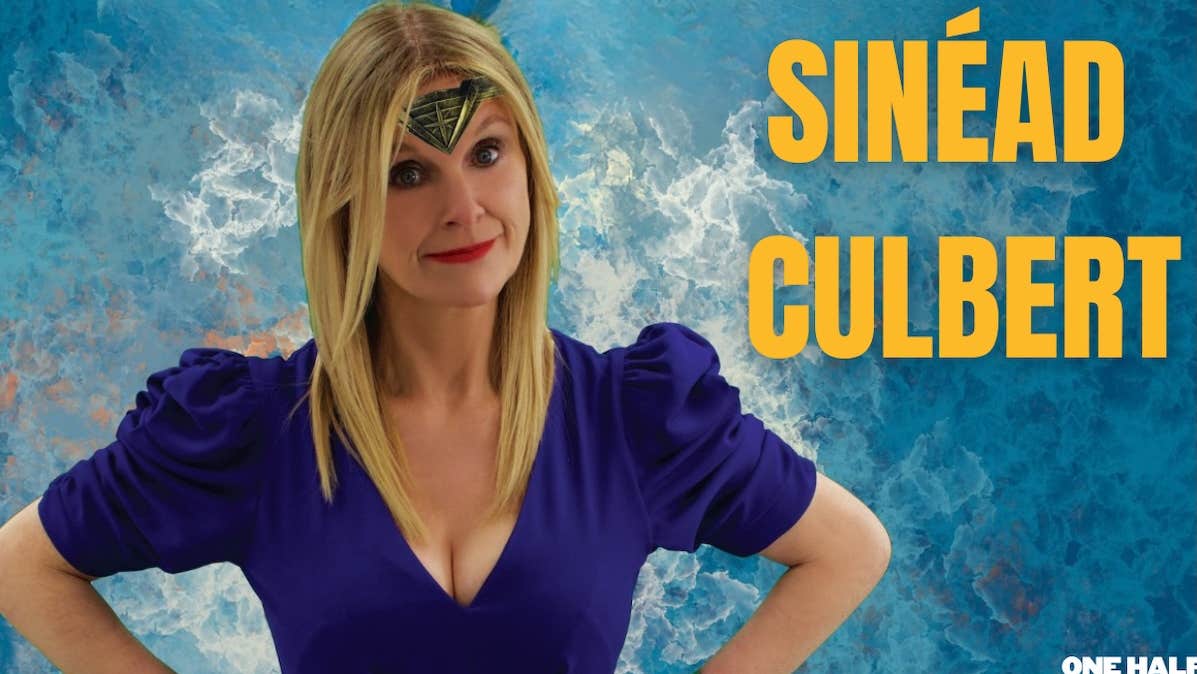 Sinead Culbert: I'm No Wonder Woman, a smiling woman standing with her hands on her hips