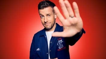 Comedian Chris Ramsey holding one hand out forewards