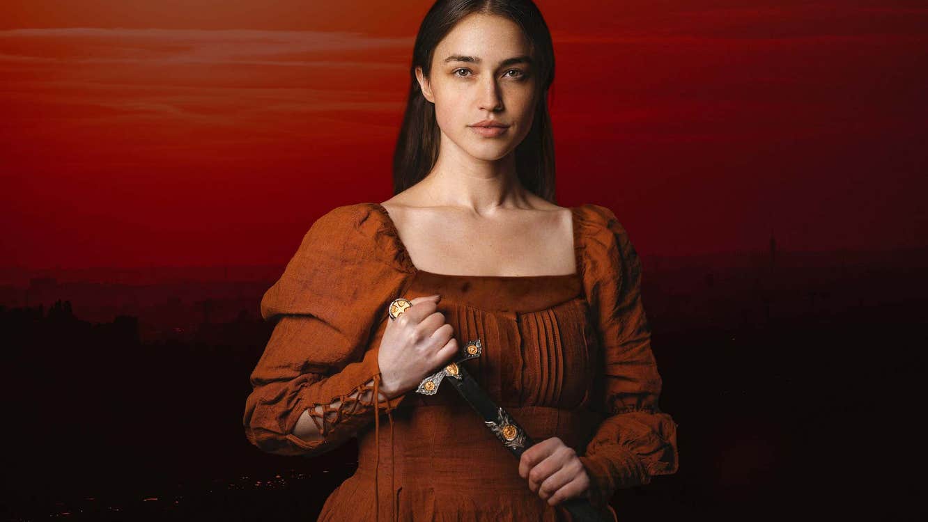 A serious woman in old red dress holding a dagger against a dark red background.