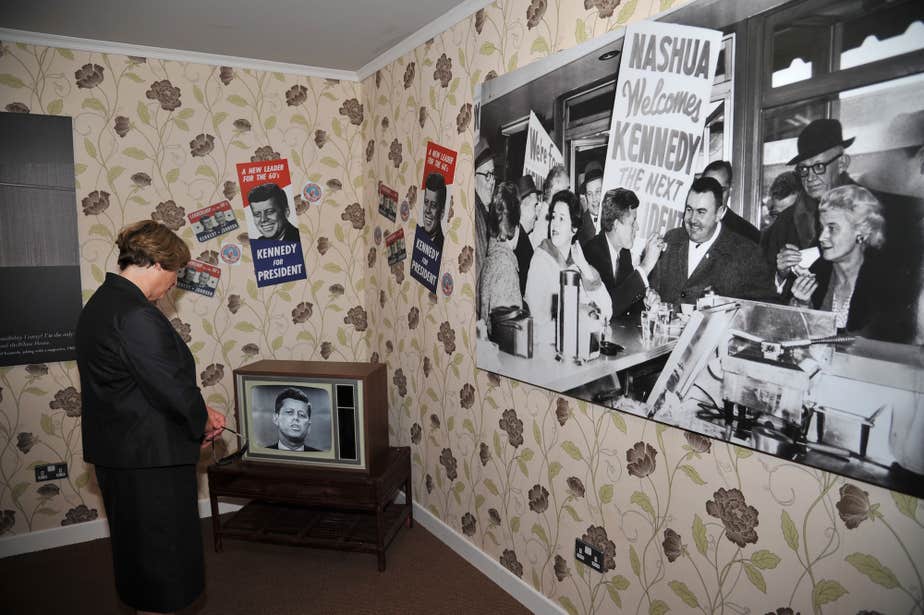 A woman studying the JFK Homestead Visitor Centre in County Wexford. 