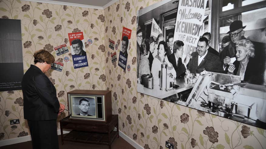 A woman studying the JFK Homestead Visitor Centre in County Wexford. 